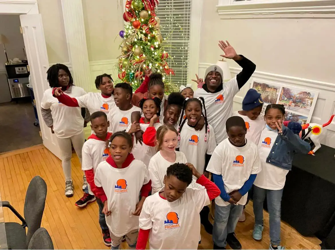 sh'kur-and-clinton-students